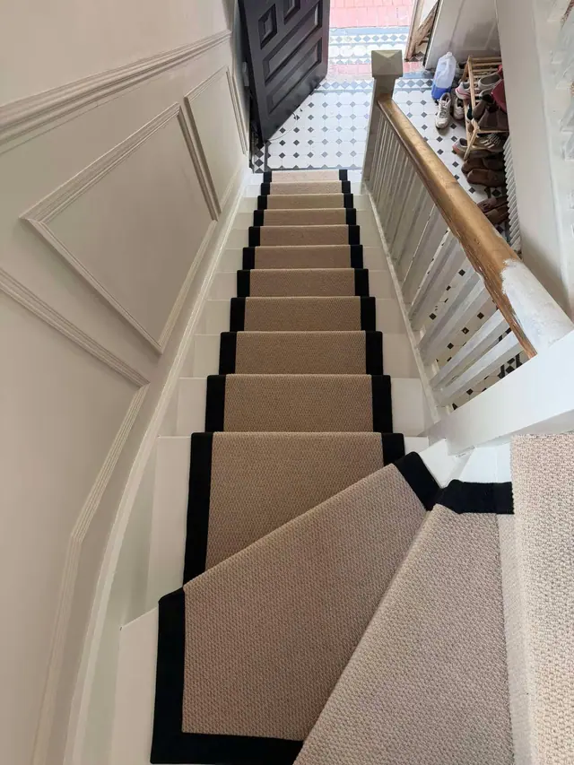 Neutral runner on a tall white staircase