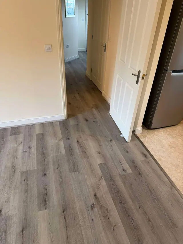 Grey laminate flowing through adjoining rooms