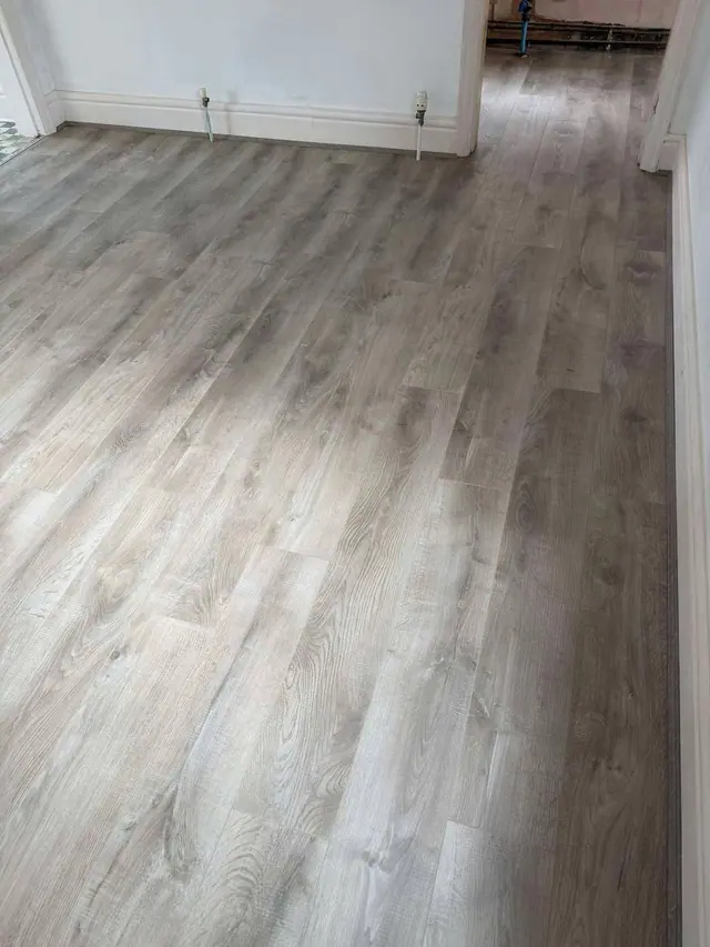 Grey laminate through adjoining rooms