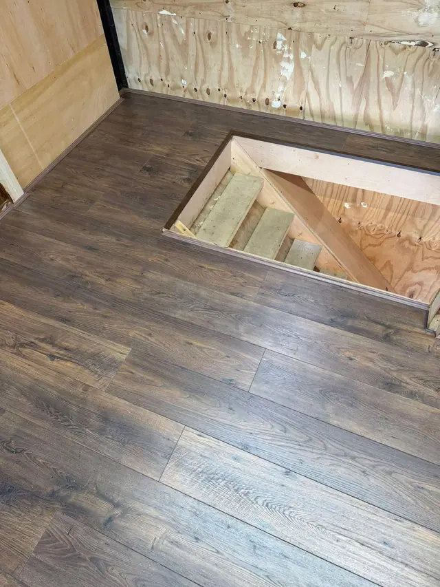 Laminate fitted around a loft stair opening