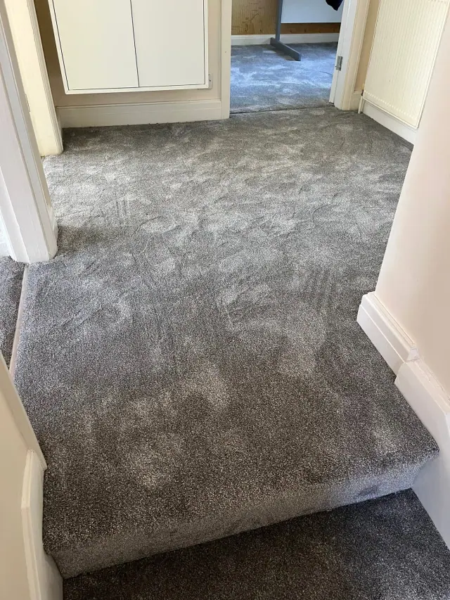 Soft grey carpet across a landing
