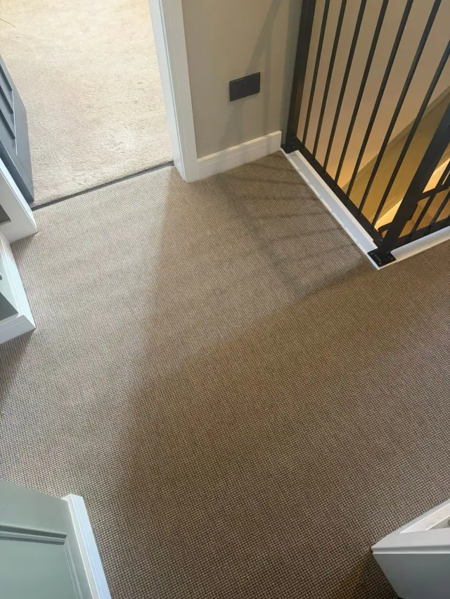 Textured carpet beside a contemporary balustrade