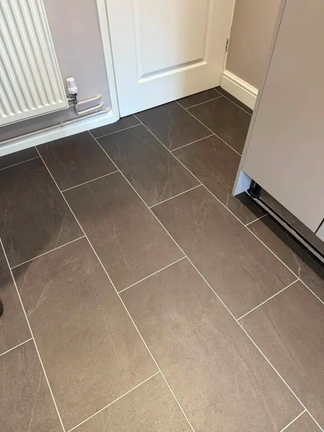 A stone-effect floor with light joint lines